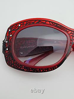 Jean Lafont Louxor 100 Lunettes de soleil avec monture rouge et noire et verres dégradés noirs, avec étui