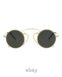 Lunettes de créateur de mode Gucci pour femmes, rondes/ovales, en or doré et gris.